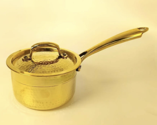 Elevate Your Culinary Experience with Our Pure Brass Hammered Saucepan  Size  Height  Diameter  Weight  Handle Length  2.5 Liter  14.5 cm  20 cm  1248 g  17 cm     Pure Brass Saucepan Hammered with Tin Coating Inner Side | Kalai | with Lid for Cooking & Serving |100% Pure Brass Cookware with Ayurvedic Health Benefits. 2.5 Liter.  Pure Brass Hammered Saucepan, a masterpiece that combines traditional craftsmanship with modern functionality. Meticulously handcrafted with a hammered finish, this saucepan not only adds a touch of sophistication to your kitchen but also delivers exceptional cooking results.  Featuring a tin-coated inner side (Kalai), this saucepan ensures even heat distribution and prevents food from sticking, preserving the natural flavours of your culinary creations. Its sturdy brass construction guarantees durability and long-lasting performance.   Key Features:  Material: High-quality pure brass with a tin-coated inner surface.  Kalai Coating: The traditional process of tin coating, known as Kalai, ensures that your food is cooked safely without any metallic reactions.  Design: Includes a sturdy handle for easy handling and a well-fitted lid to retain heat and moisture during cooking.  Versatility: Ideal for both serving dishes at the table and preparing meals in the kitchen.  Health Benefits: Brass utensils retain more than 90% of the nutrients in food, making them a healthier alternative to modern non-stick cookware.  Usage & Care:  Suitable for all types of stove-tops.  Avoid overheating the pan when empty to preserve the tin coating.  Why Choose This Product?  This saucepan is more than just a cooking tool; it’s a piece of tradition that brings the benefits of ancient cooking practices into your modern kitchen. Perfect for those who value both aesthetics and health, this saucepan enhances the flavour of your food while providing a beautiful presentation.